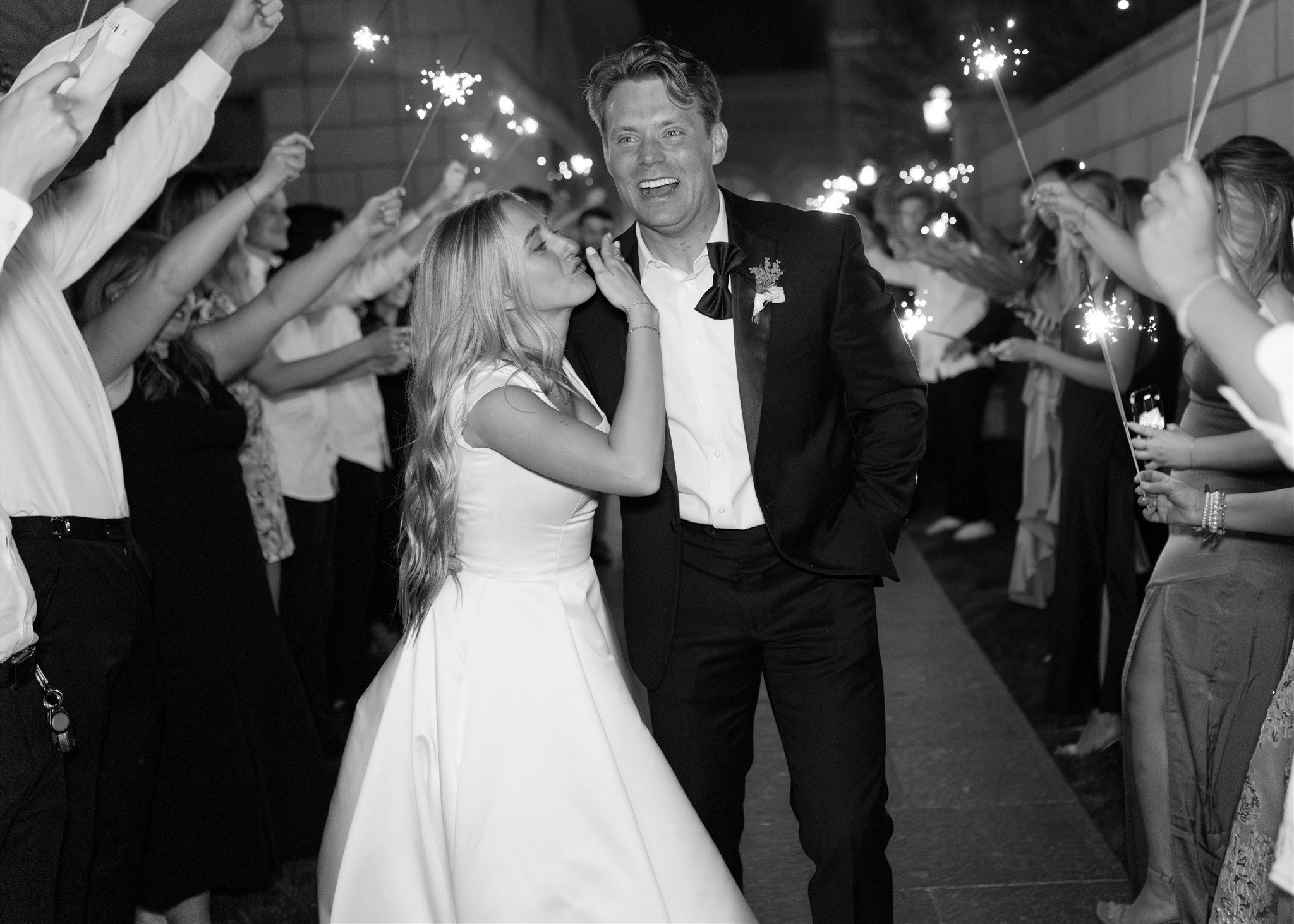 Wedding reception celebration with sparklers creating a magical nighttime atmosphere.